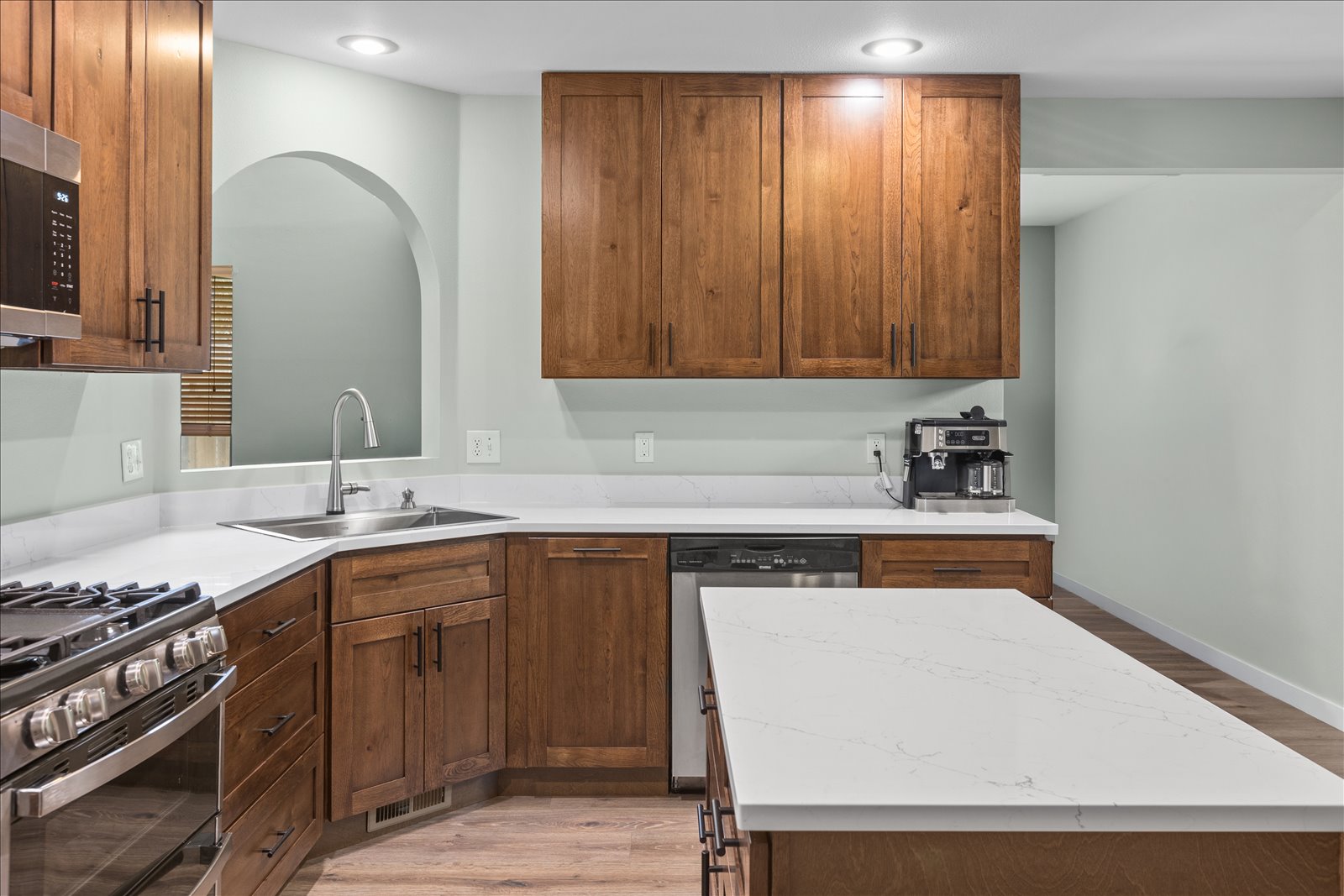 Kitchen renovation with custom cabinetry and quartz countertops